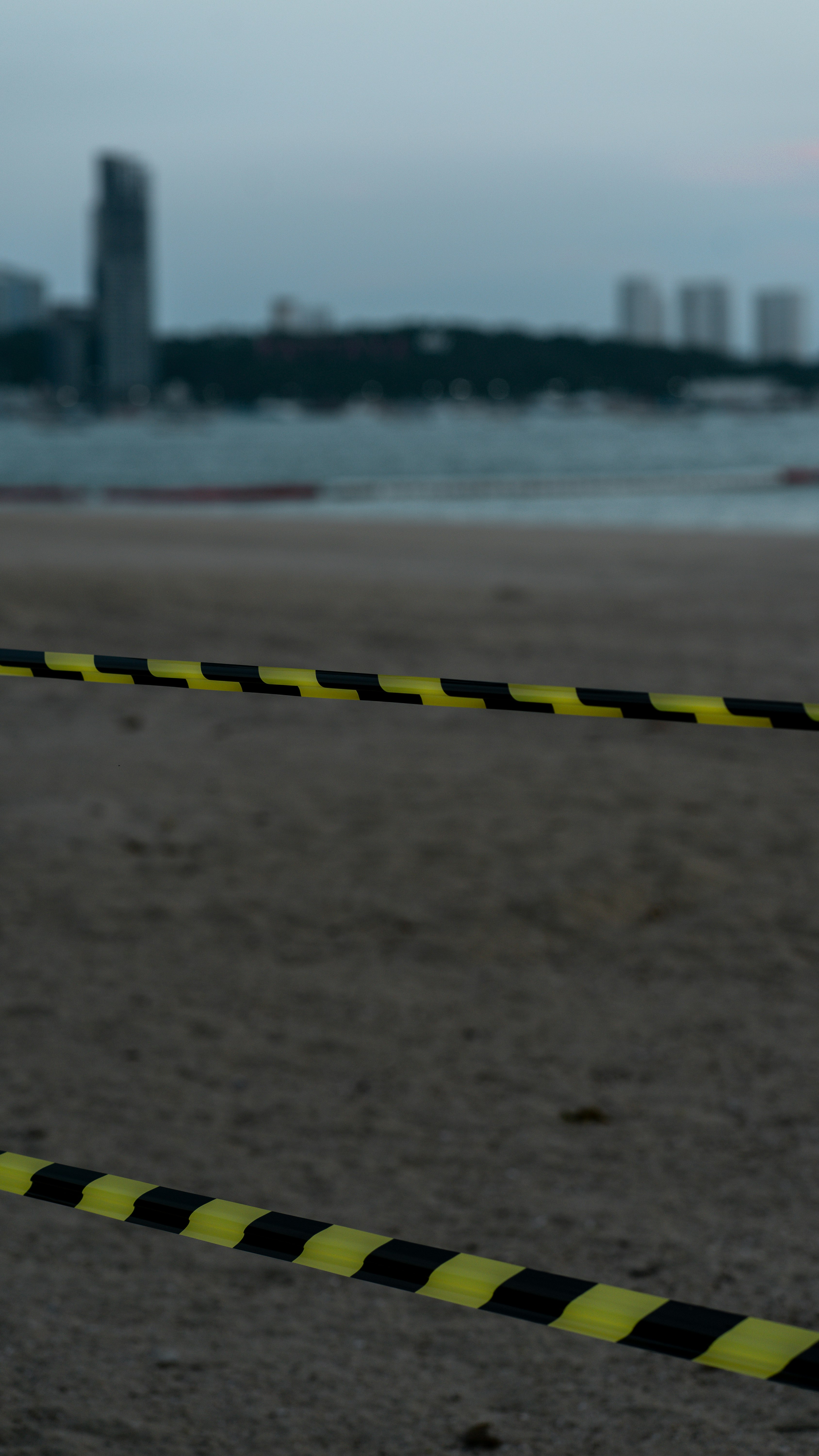 yellow and black metal bar on brown sand during daytime